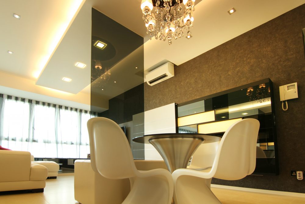 Dark textured wallpaper and a built-in backlit display cabinet frame the dining area's second wall, adding storage and a place to show off decorative