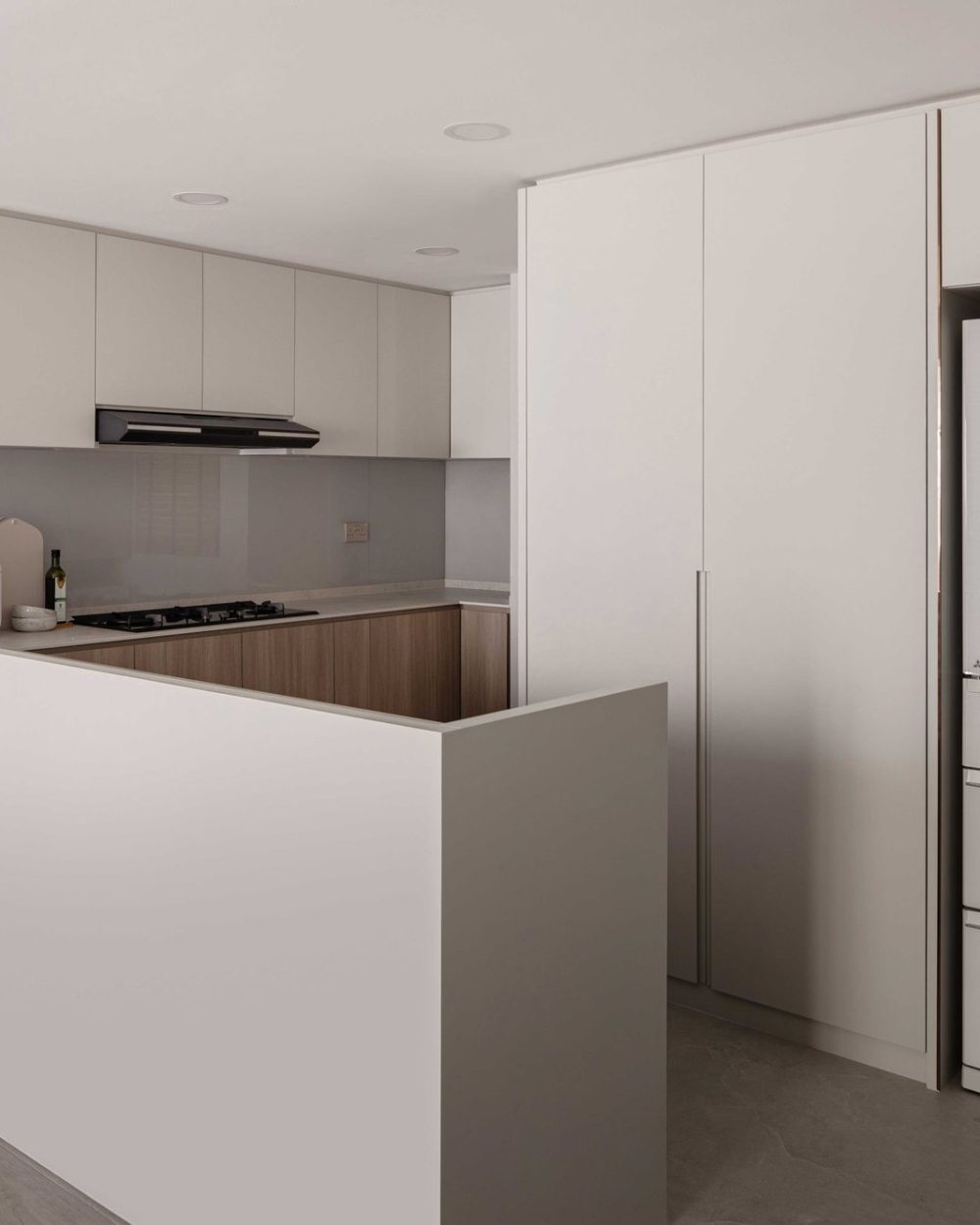 A stainless steel kettle and rice cooker sit ready on the counter, framed by soft under-cabinet lighting.