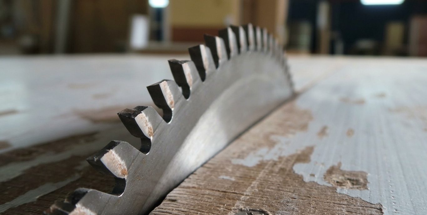In-house carpentry: a saw blade cutting through timber in the workshop.