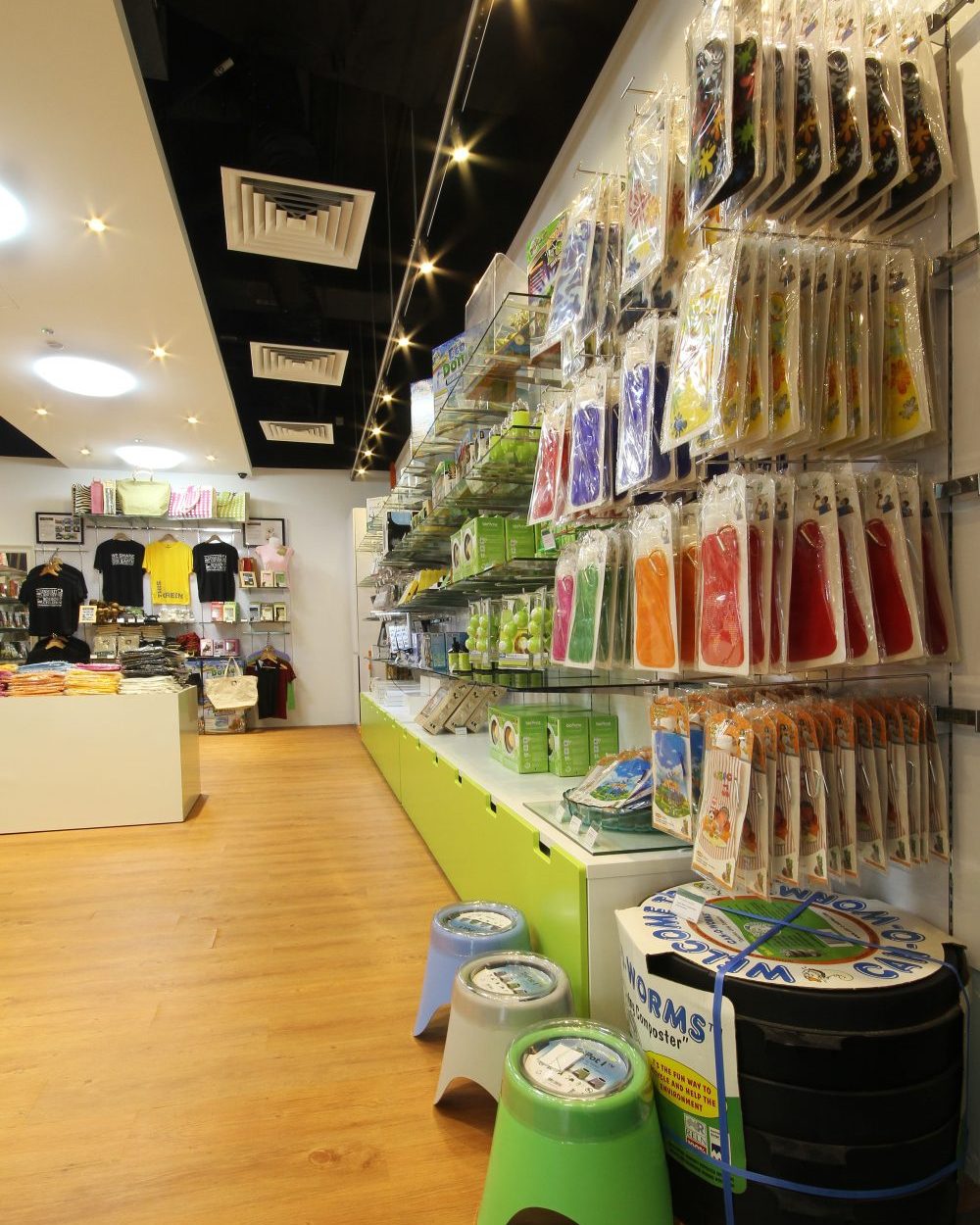 Hanging retail fixtures line a full display wall, keeping smaller packaged items organised and easy to browse.