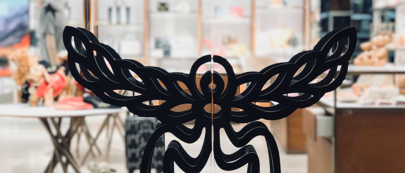 MCM's wing-and-flower brand emblem applied to the glass entrance doors at Paragon mall.
